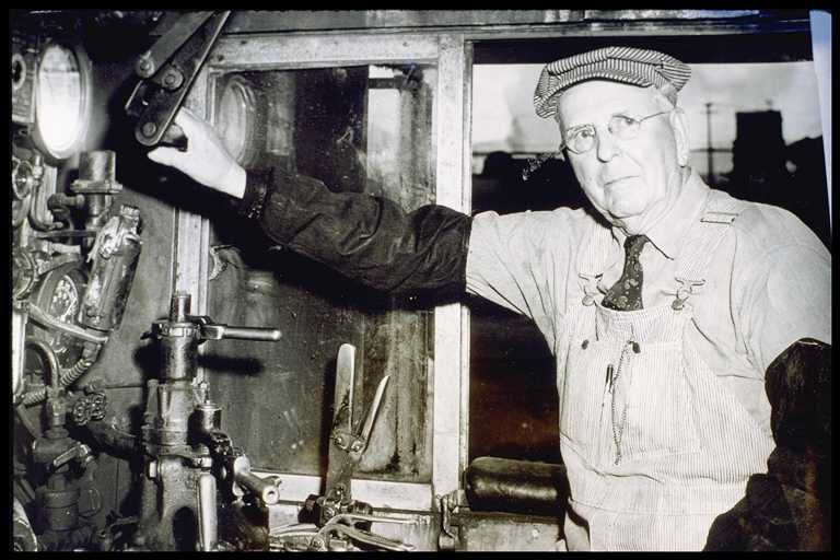 Engineer Olsen in Cab of Locomotive #4446 at his Retirement Party