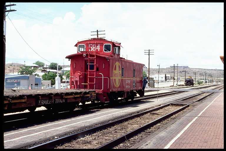 Caboose #584. Rear of Freight Train Picking Up Orders