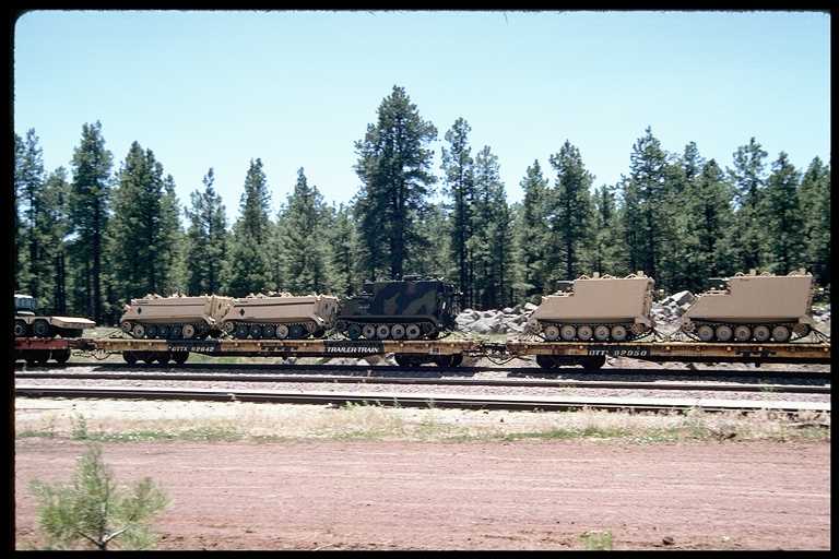 Train carrying military vehicles.