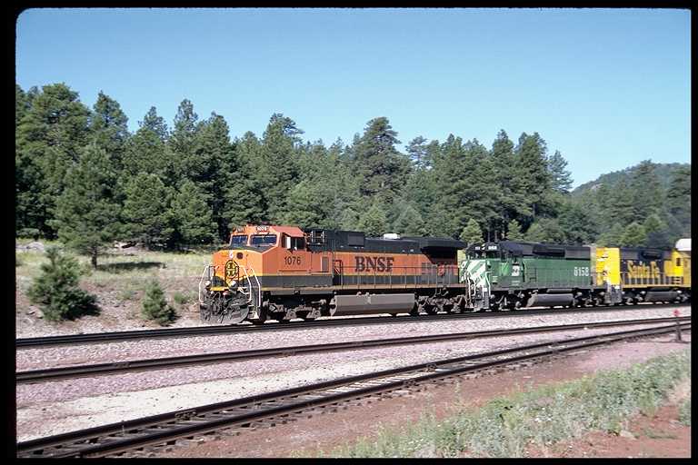 East bound freight train with new orange/green paint scheme.