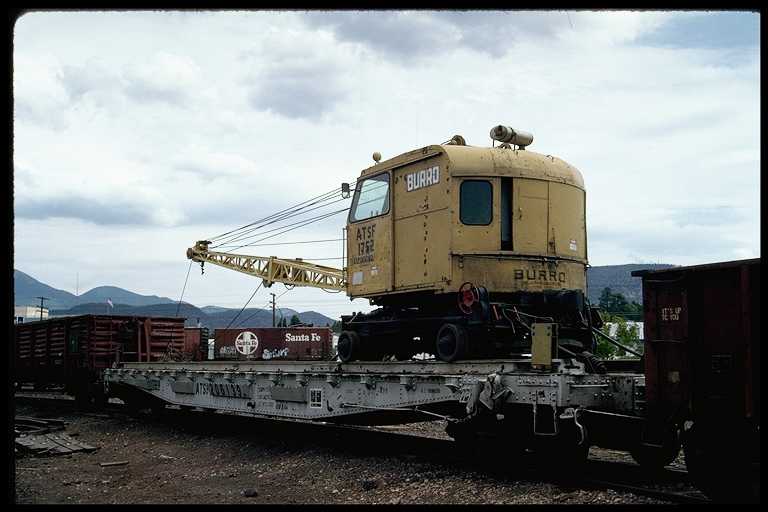 Crane used for MOW (Maintenance Of Way) service. Crane can travel the length of the flatcar.