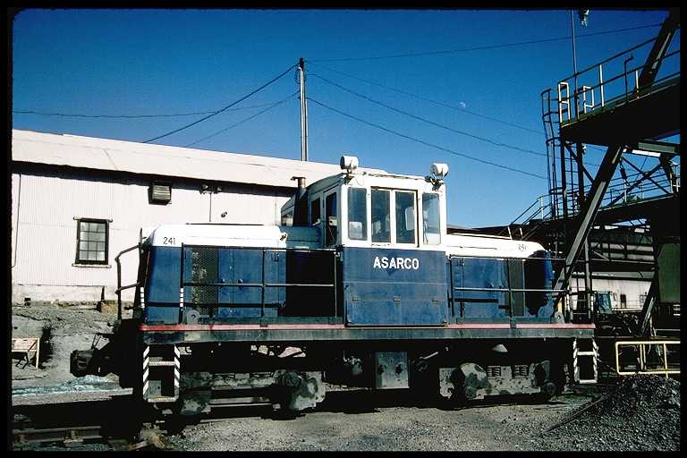 Center cab diesel at ASARCO smelter.  Truck axles are connected by side rods.