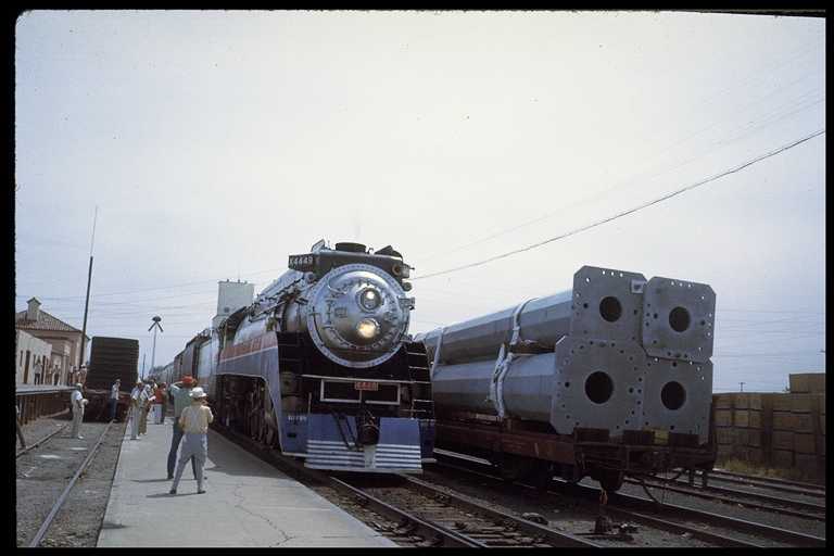 SP locomotive #4449.  Car next to engine is loaded with metal power poles.